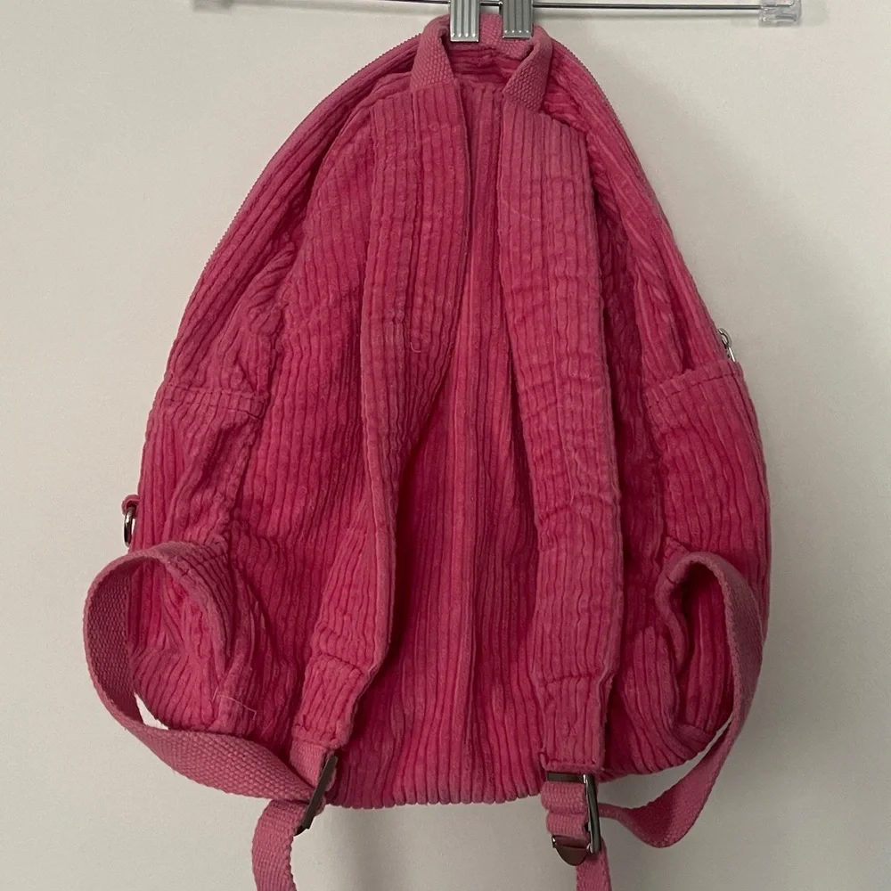 Pink urban outfitters corduroy backpack
